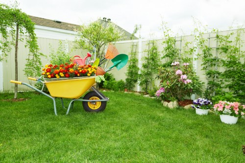 Gardener performing final checks on a landscaped area